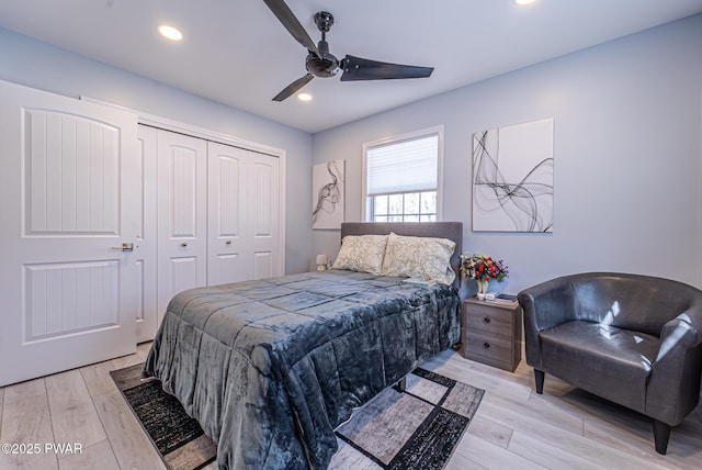 bedroom with light wood-style floors, recessed lighting, a closet, and a ceiling fan