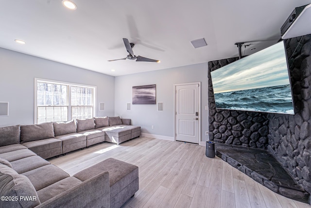 living area featuring a ceiling fan, light wood-type flooring, baseboards, and recessed lighting