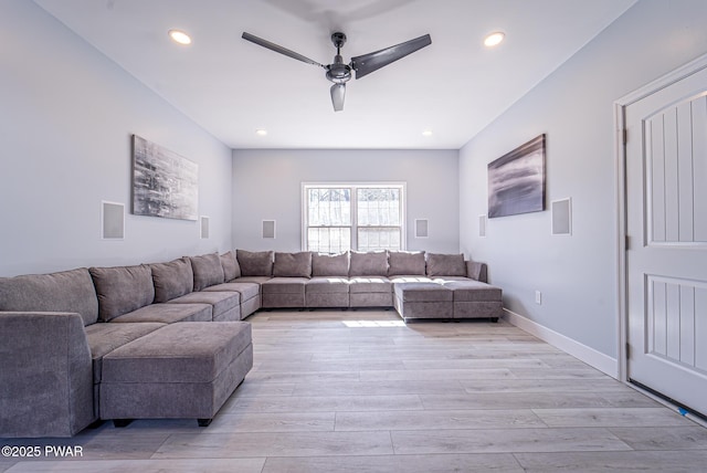 living area featuring light wood-style floors, ceiling fan, baseboards, and recessed lighting