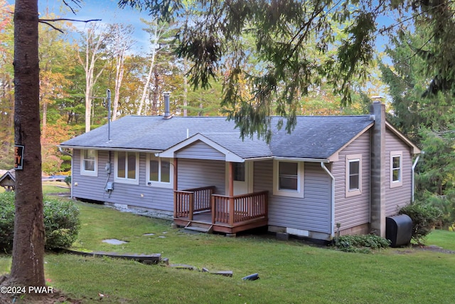 view of front of property with a front lawn and a wooden deck