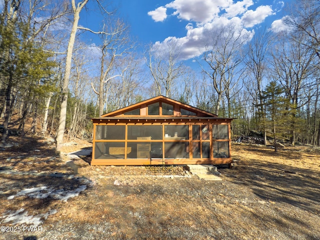 back of house with a sunroom