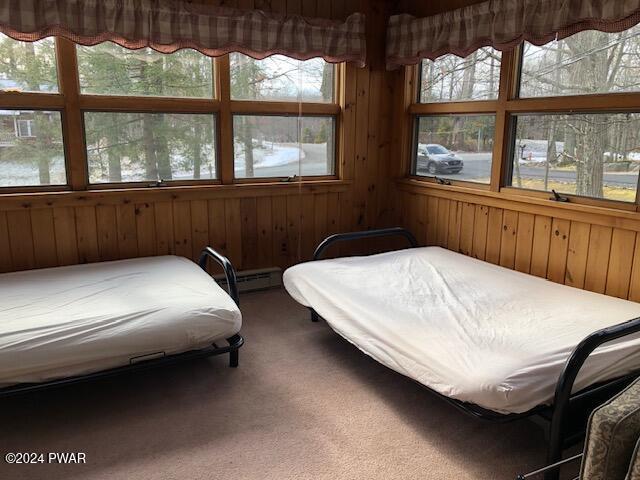 bedroom with carpet flooring and a baseboard radiator