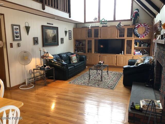 living room with a fireplace and light hardwood / wood-style floors