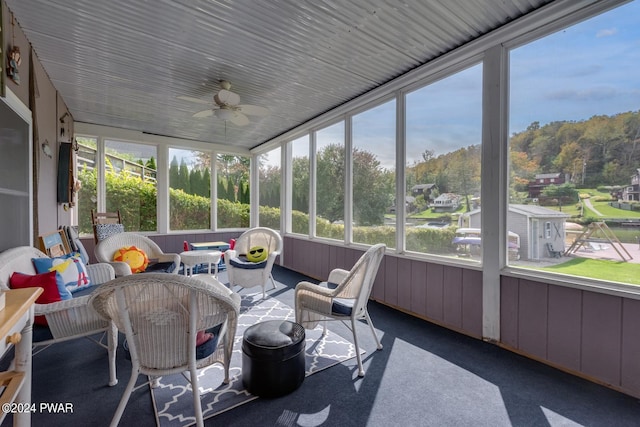 sunroom / solarium with ceiling fan