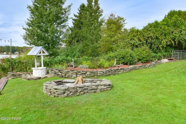 view of yard with an outdoor fire pit