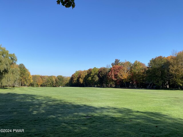 view of home's community featuring a lawn