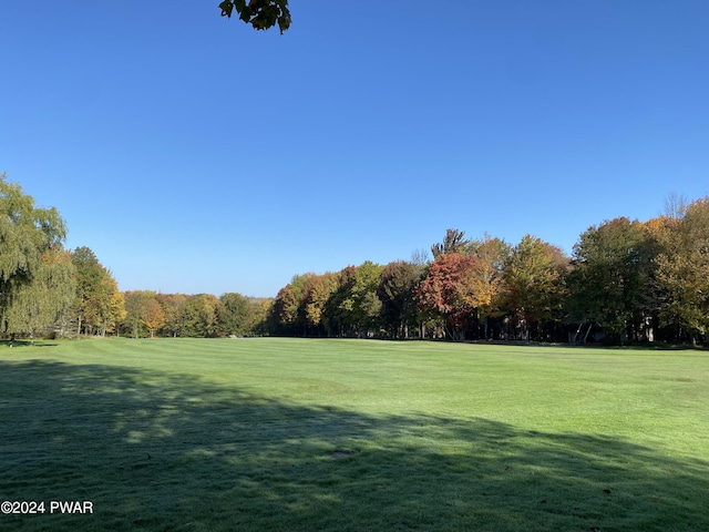 view of home's community featuring a lawn