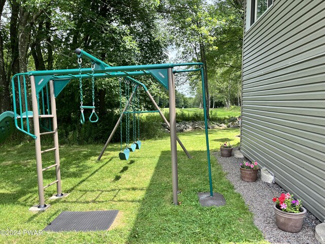 view of jungle gym with a lawn