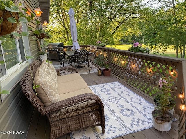 wooden terrace featuring outdoor lounge area