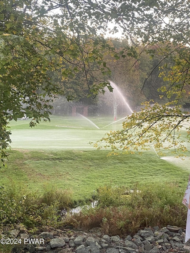 surrounding community with a lawn