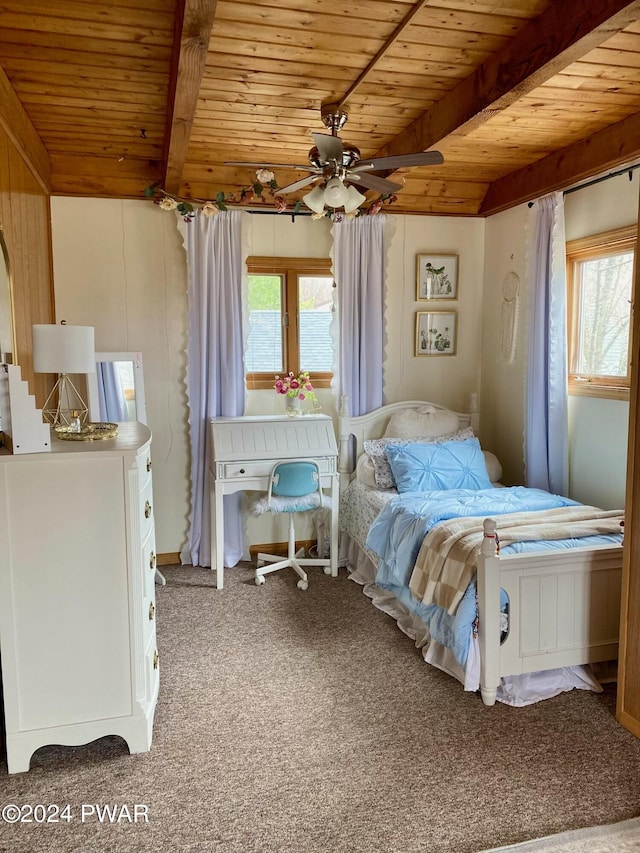 bedroom with carpet, beam ceiling, ceiling fan, and wooden ceiling