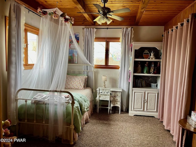 unfurnished bedroom featuring multiple windows, carpet, ceiling fan, and wooden walls