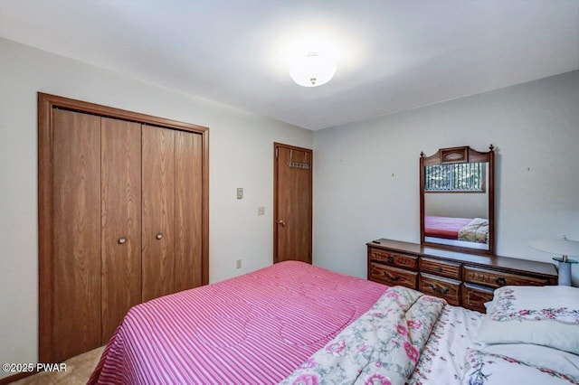 carpeted bedroom featuring a closet