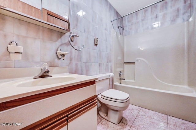 full bathroom with vanity, toilet, shower / bath combination, and tile walls