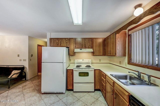 kitchen with sink and white appliances