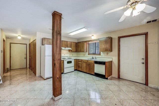 kitchen with white appliances, ceiling fan, and sink