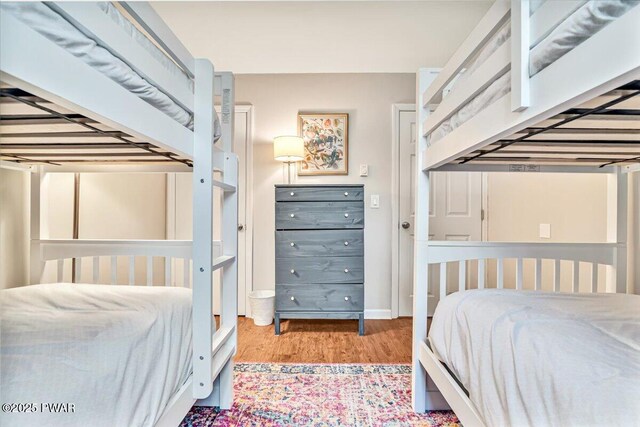 bedroom featuring wood finished floors
