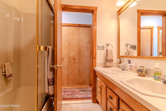 117 Circle Dr, Hawley, PA 18428 - bathroom featuring double vanity, a sink, and a shower with door