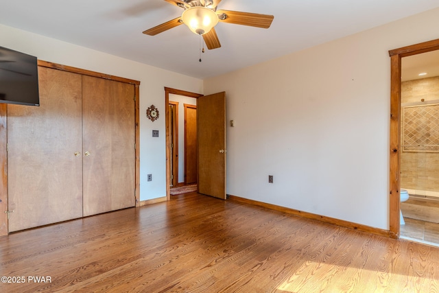 117 Circle Dr, Hawley, PA 18428 - unfurnished bedroom featuring light wood-style floors, baseboards, a closet, and connected bathroom