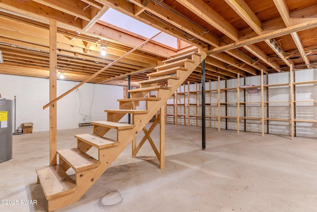 117 Circle Dr, Hawley, PA 18428 - unfinished below grade area featuring stairway and electric water heater