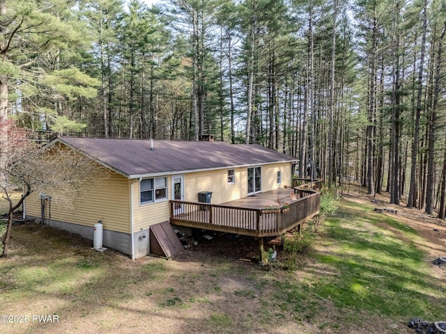 117 Circle Dr, Hawley, PA 18428 - rear view of property with a view of trees, roof with shingles, and a deck
