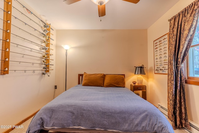 117 Circle Dr, Hawley, PA 18428 - carpeted bedroom with ceiling fan and a baseboard radiator