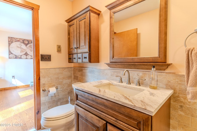117 Circle Dr, Hawley, PA 18428 - bathroom featuring tile walls, a wainscoted wall, and toilet