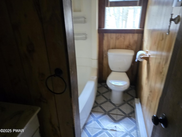 bathroom with walk in shower and toilet