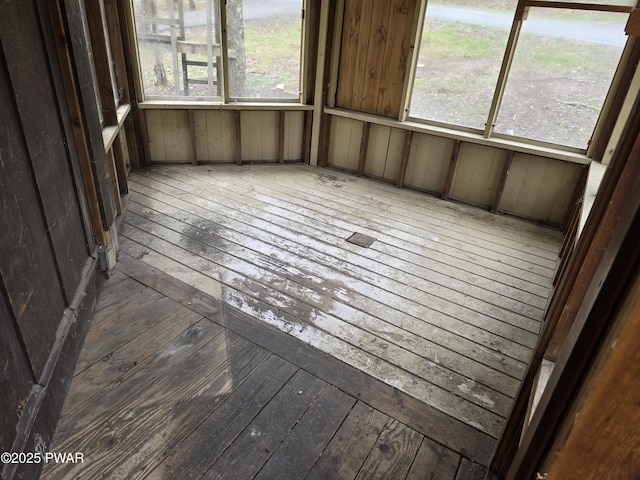 unfurnished sunroom with a healthy amount of sunlight