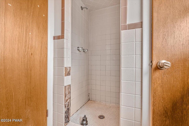 bathroom with a tile shower