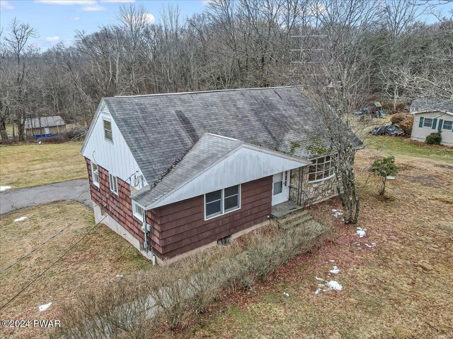 view of side of home featuring a yard