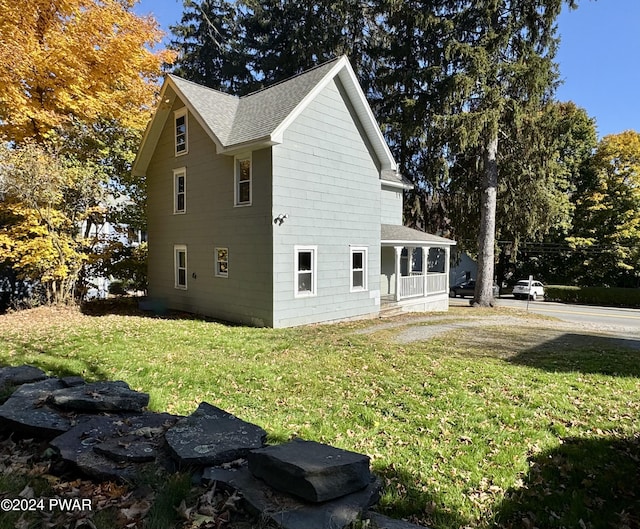 view of home's exterior featuring a lawn