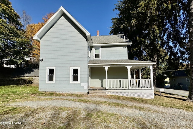 view of front of property featuring covered porch