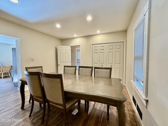 dining room with hardwood / wood-style flooring