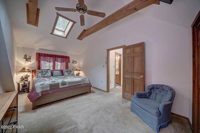 carpeted bedroom featuring ceiling fan and vaulted ceiling with skylight