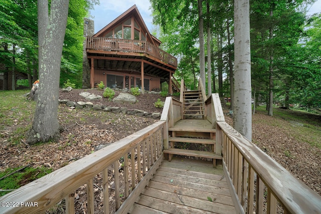 back of property featuring a wooden deck