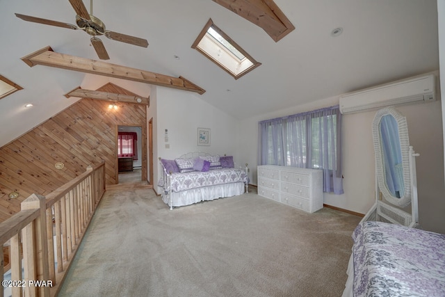 bedroom with ceiling fan, a wall mounted AC, wood walls, light colored carpet, and vaulted ceiling with skylight