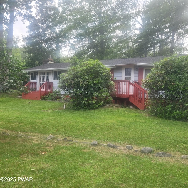 117 W Shore Dr, Dingmans Ferry, PA 18328 - back of property featuring a yard and a chimney
