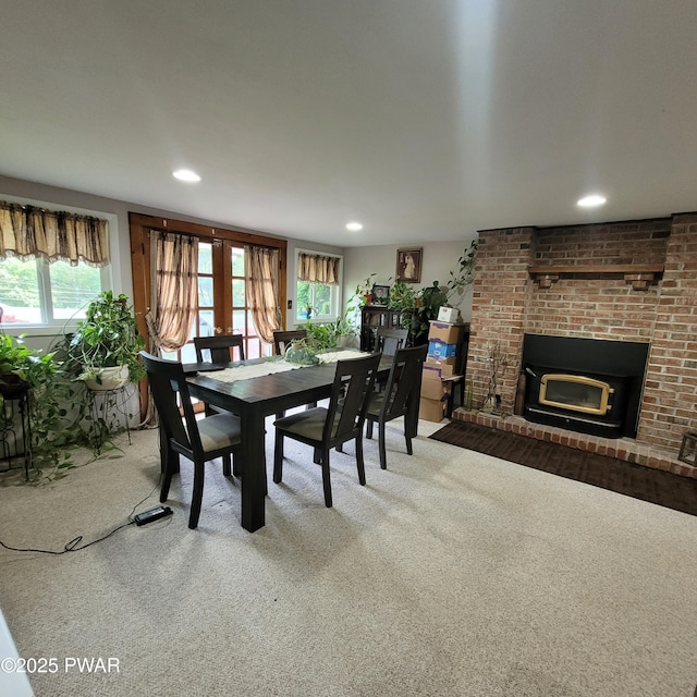 117 W Shore Dr, Dingmans Ferry, PA 18328 - dining area with carpet flooring, healthy amount of natural light, a fireplace, and recessed lighting