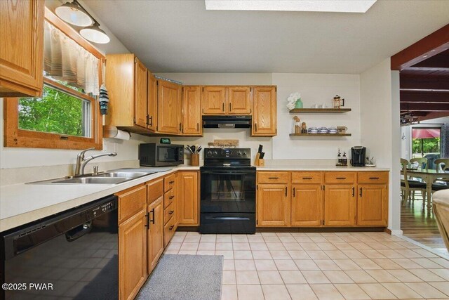 173 Paper Birch S, Tafton, PA 18464 - kitchen featuring black appliances, under cabinet range hood, light countertops, and a sink