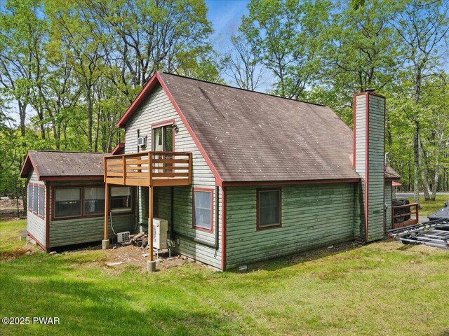 173 Paper Birch S, Tafton, PA 18464 - rear view of property with a wooden deck, a lawn, and a chimney