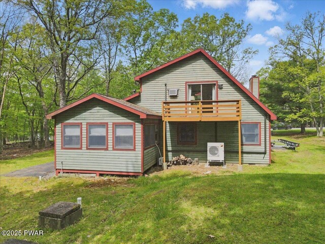 173 Paper Birch S, Tafton, PA 18464 - back of house featuring a yard, a chimney, and a cooling unit