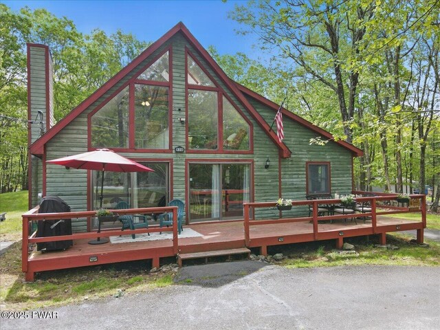173 Paper Birch S, Tafton, PA 18464 - rear view of property featuring a wooden deck and a chimney