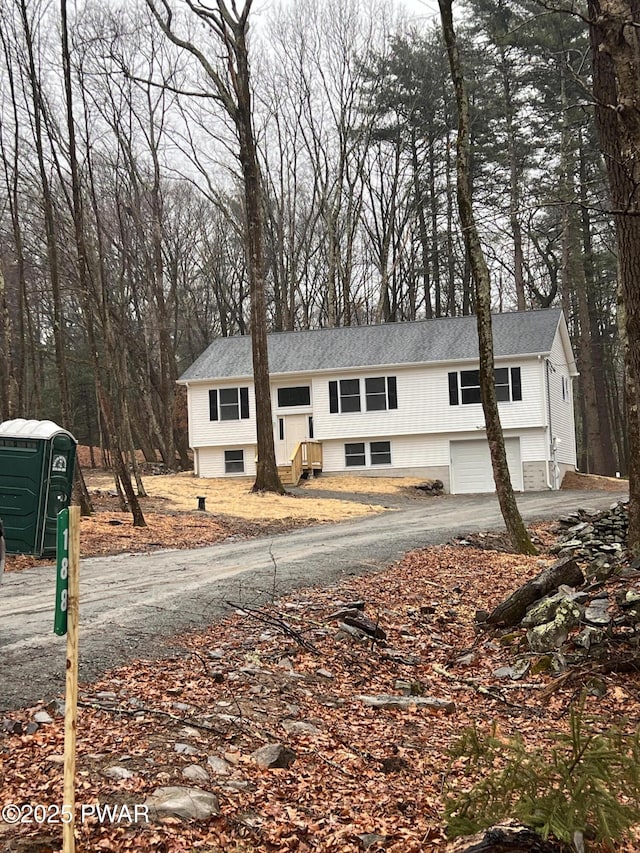 raised ranch featuring a garage