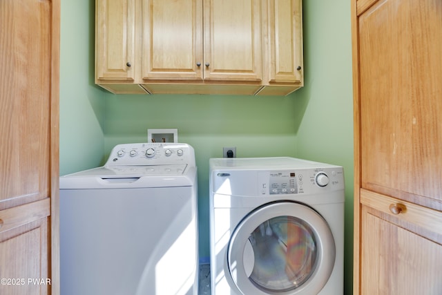 laundry room with washer and dryer and cabinet space