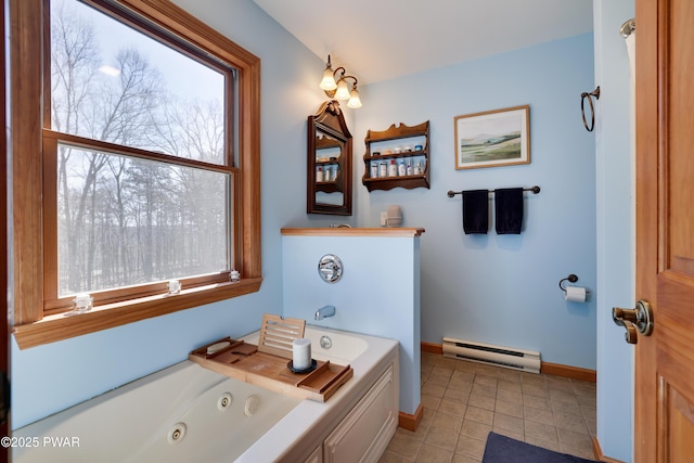 bathroom featuring a baseboard heating unit, tile patterned floors, a jetted tub, and baseboards