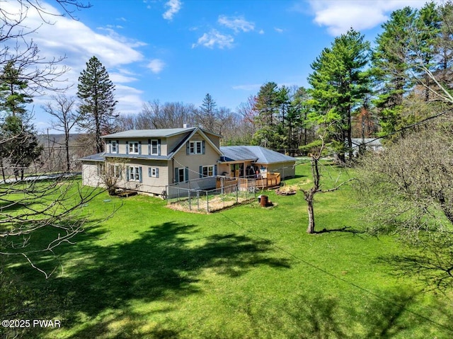 back of property with a yard