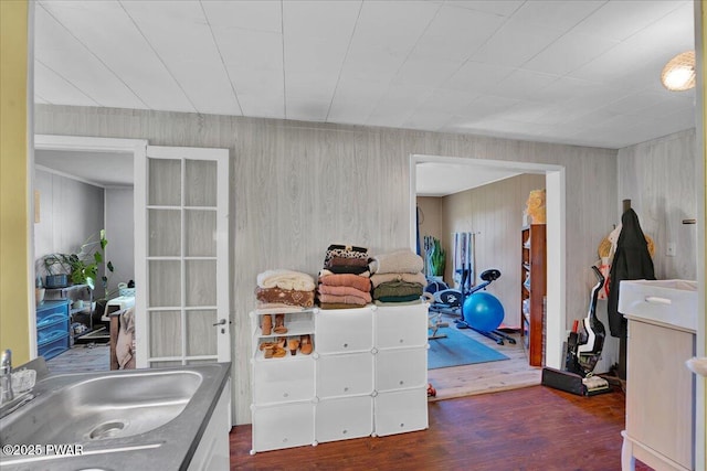 interior space with a sink and wood finished floors