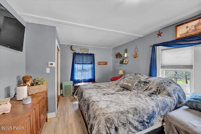 bedroom with light wood finished floors