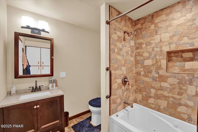 full bathroom featuring vanity, shower / bathing tub combination, baseboards, and toilet